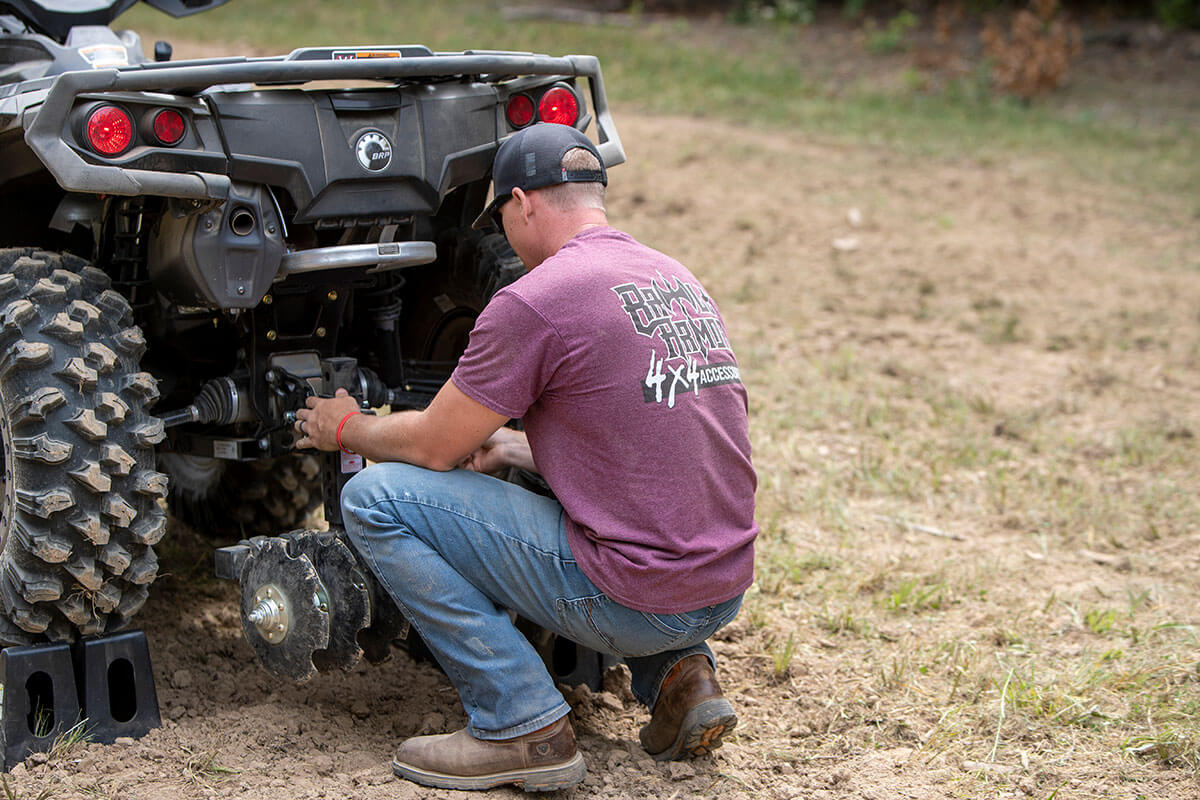 Lowering the Big Buck Food Plot Plow on an ATV after initial groundbreaking